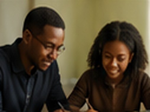 Tutor working one-on-one with a student at home